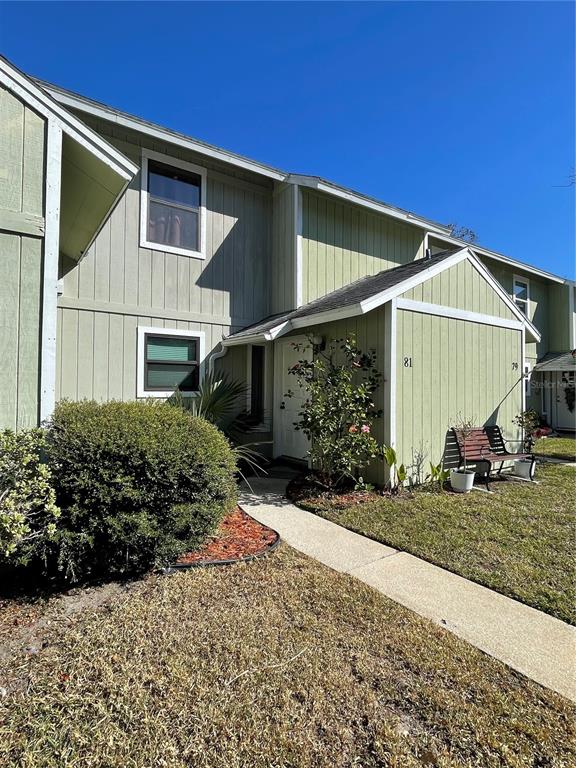 a view of a house with a yard