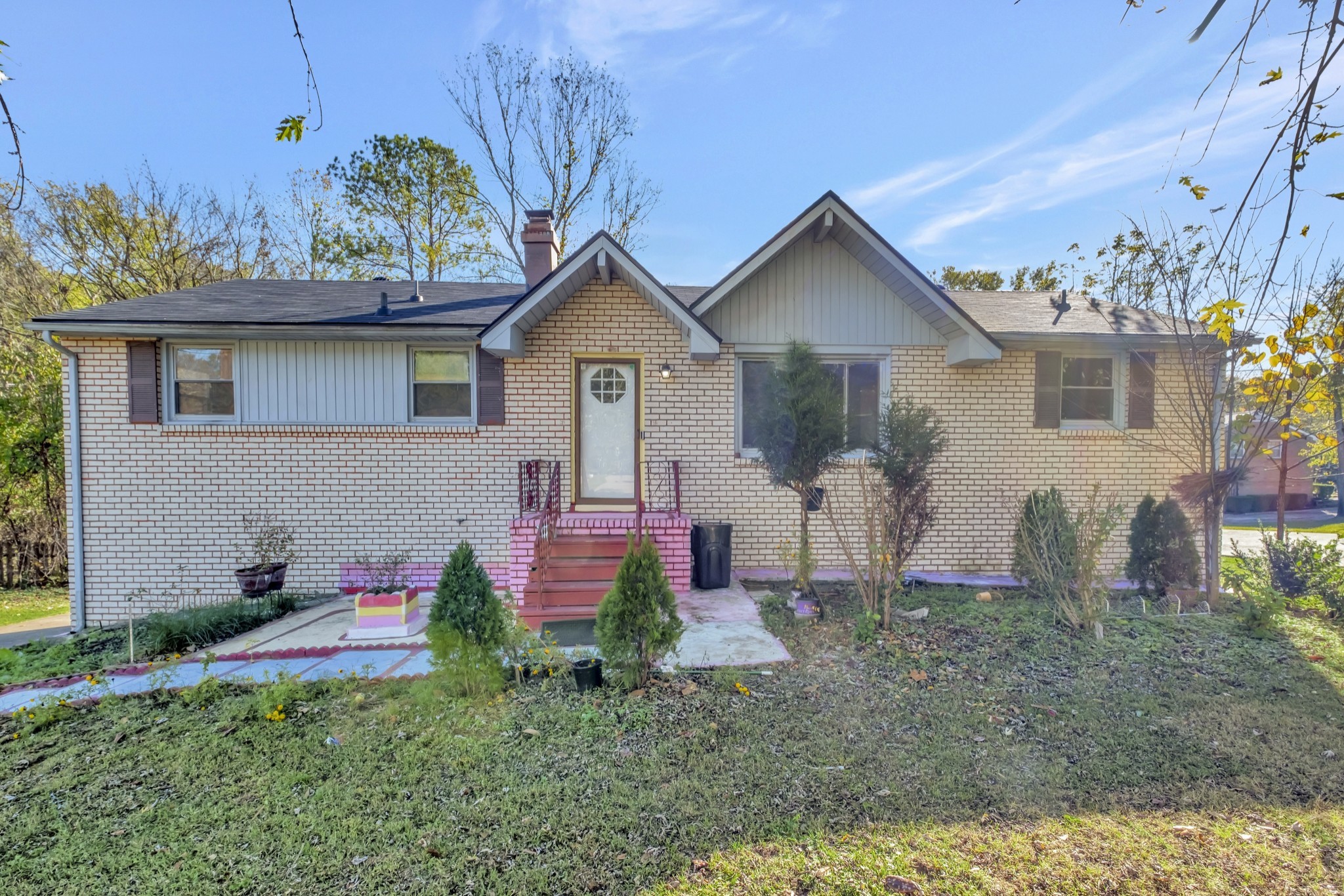 a front view of a house with garden