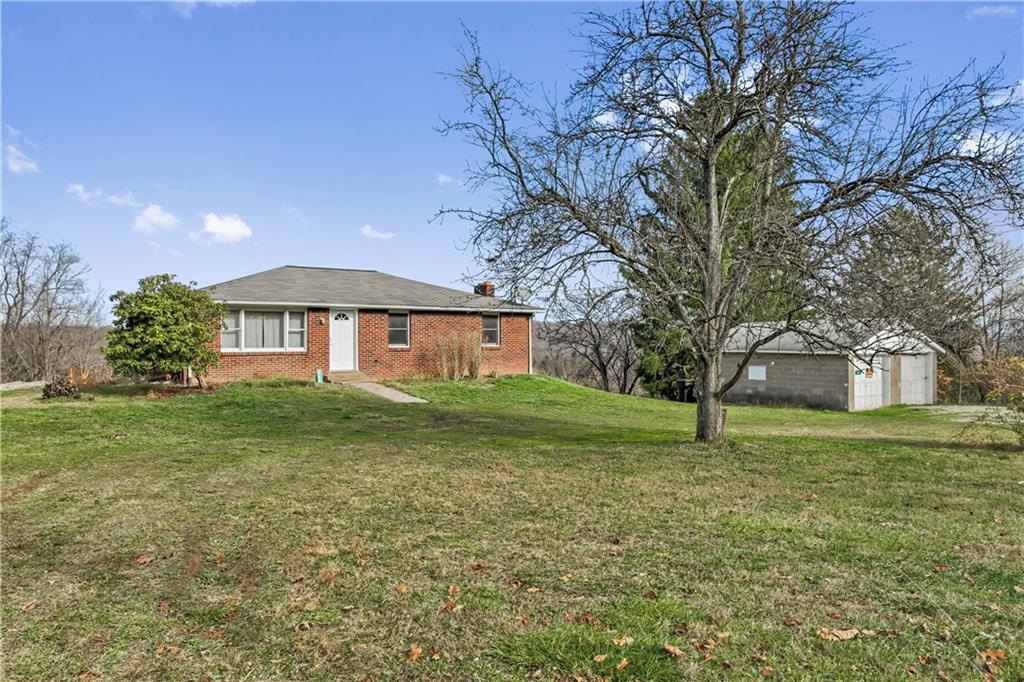 a view of a big yard with a house