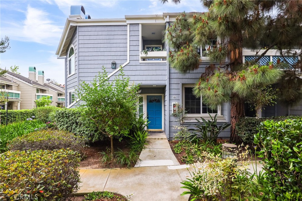 front view of a house with potted plants