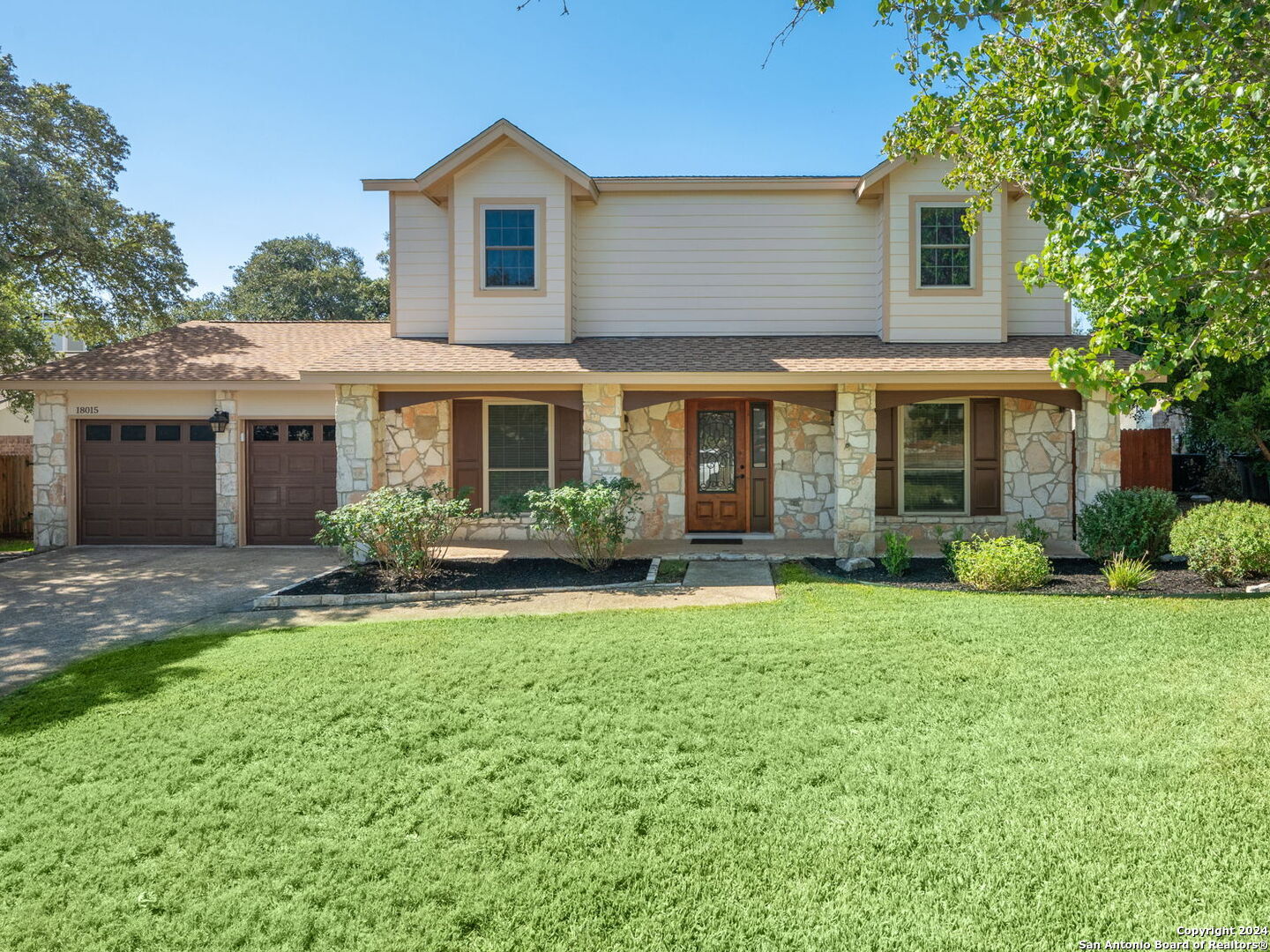 front view of a house and a yard