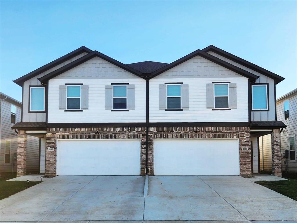 a front view of a house with garage