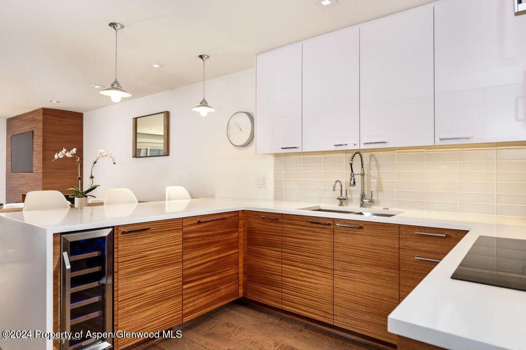 a kitchen with a sink and cabinets