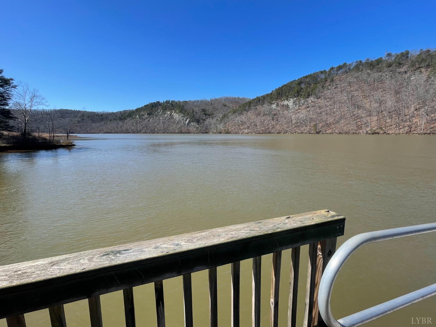 a view of balcony with outdoor space and lake view