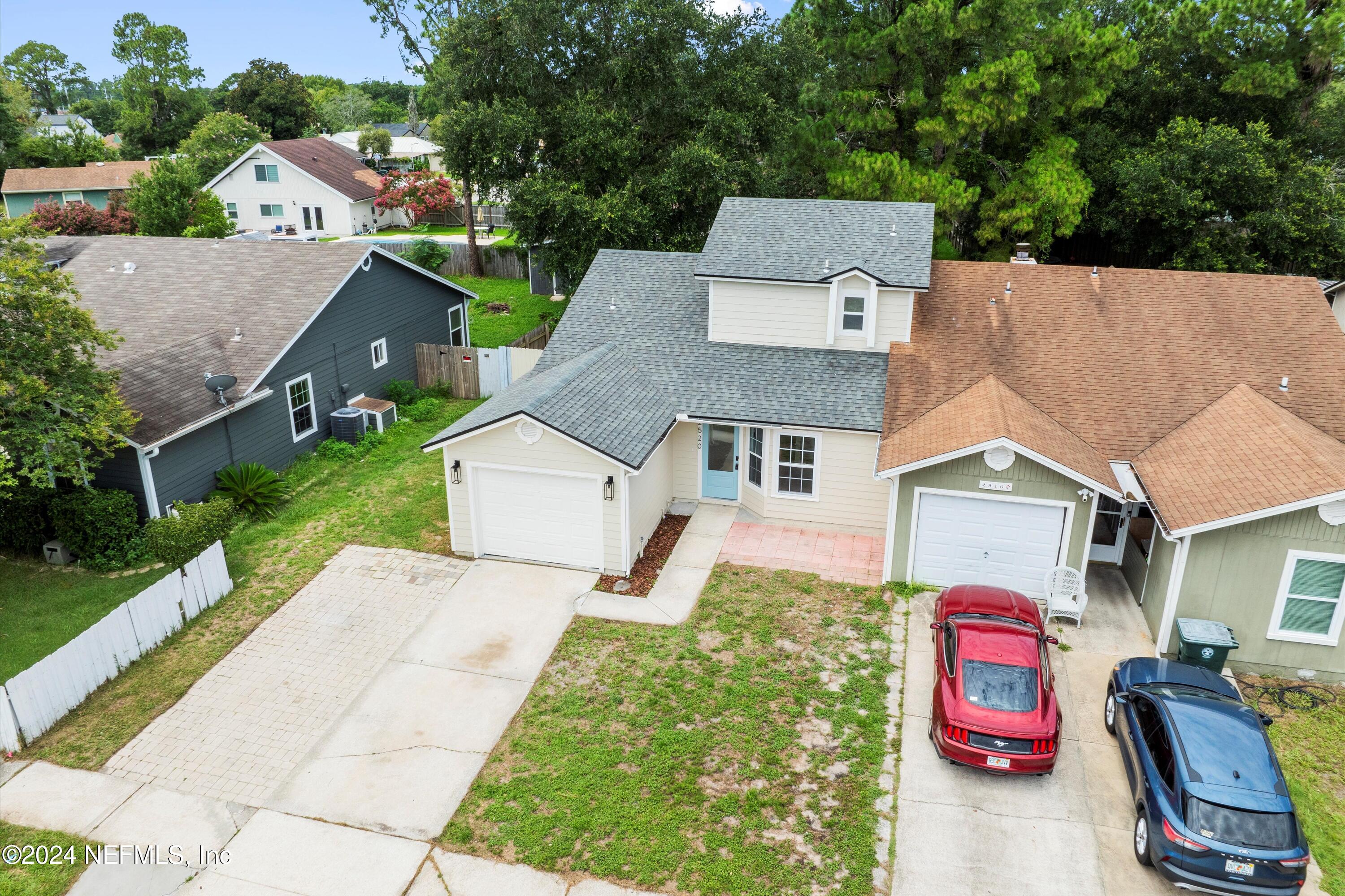 an aerial view of house with yard