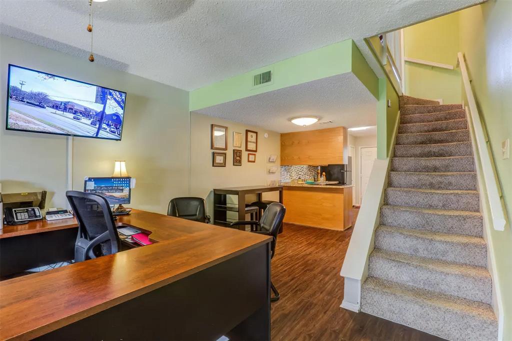 a living room with furniture and a dining table