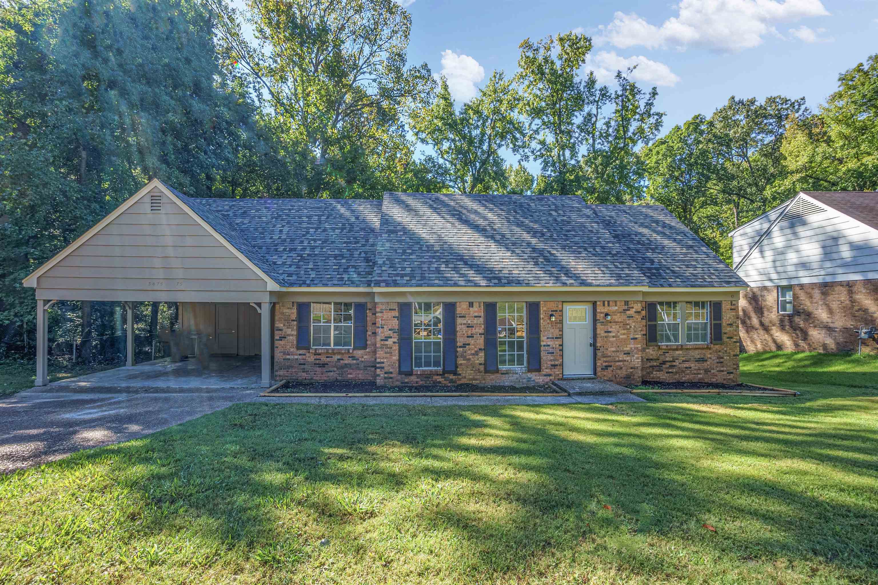 front view of a house with a yard