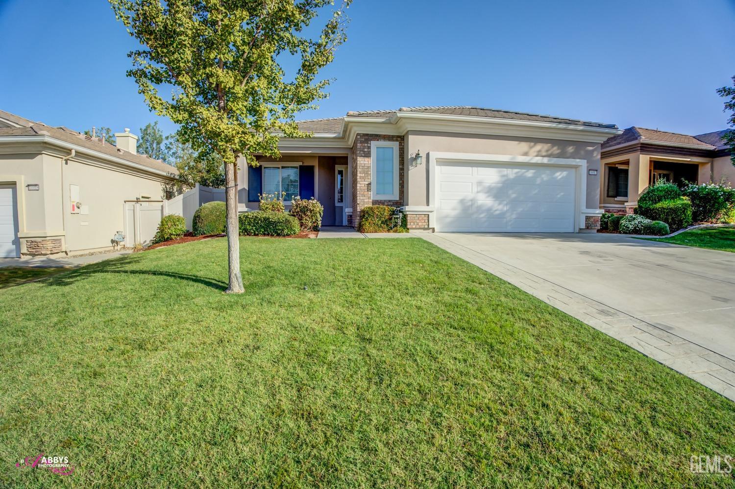 front view of a house and a yard