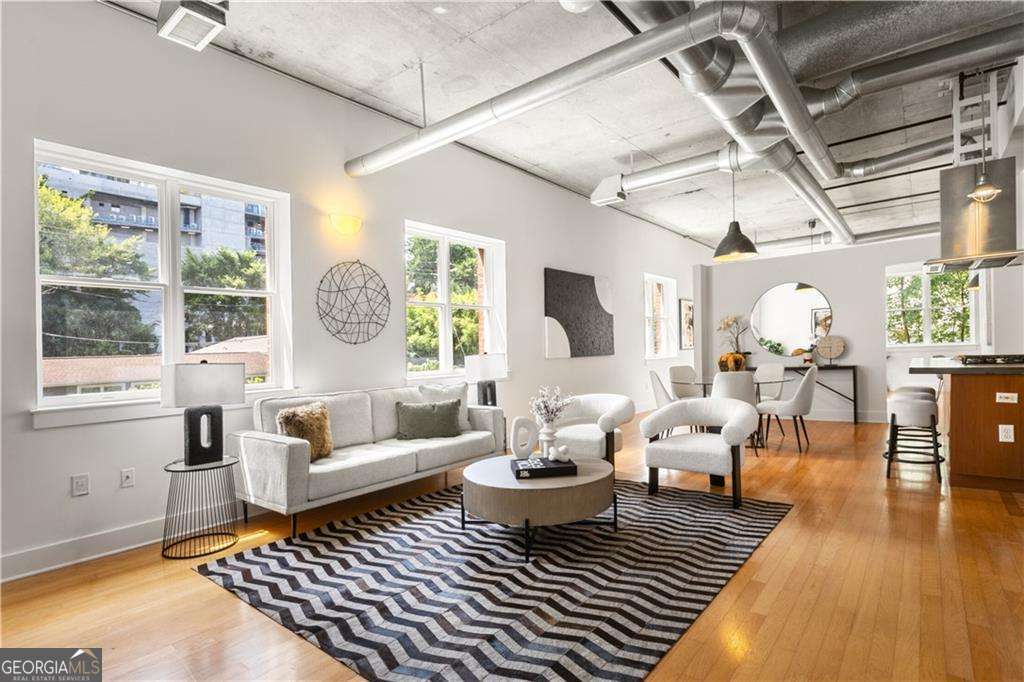 a living room with furniture or couch and a window