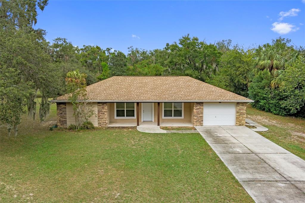 front view of a house with a yard