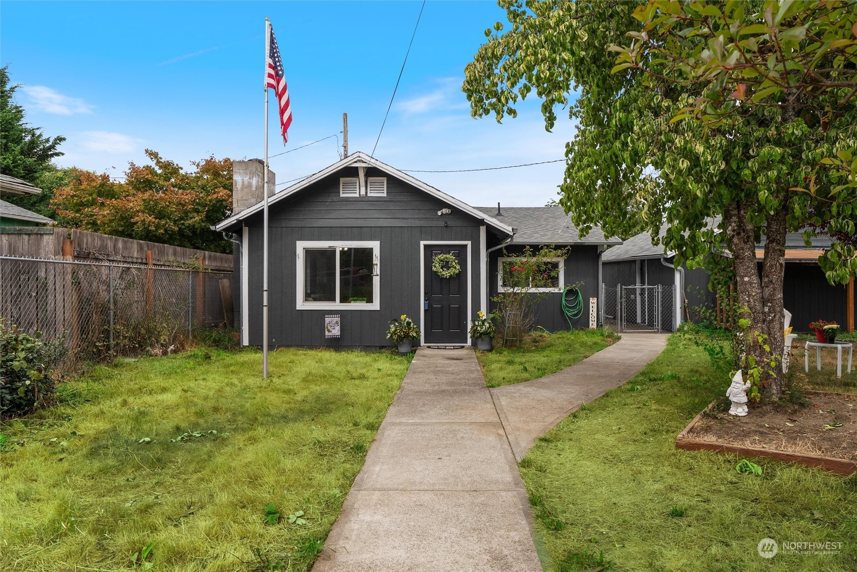 a front view of a house with garden