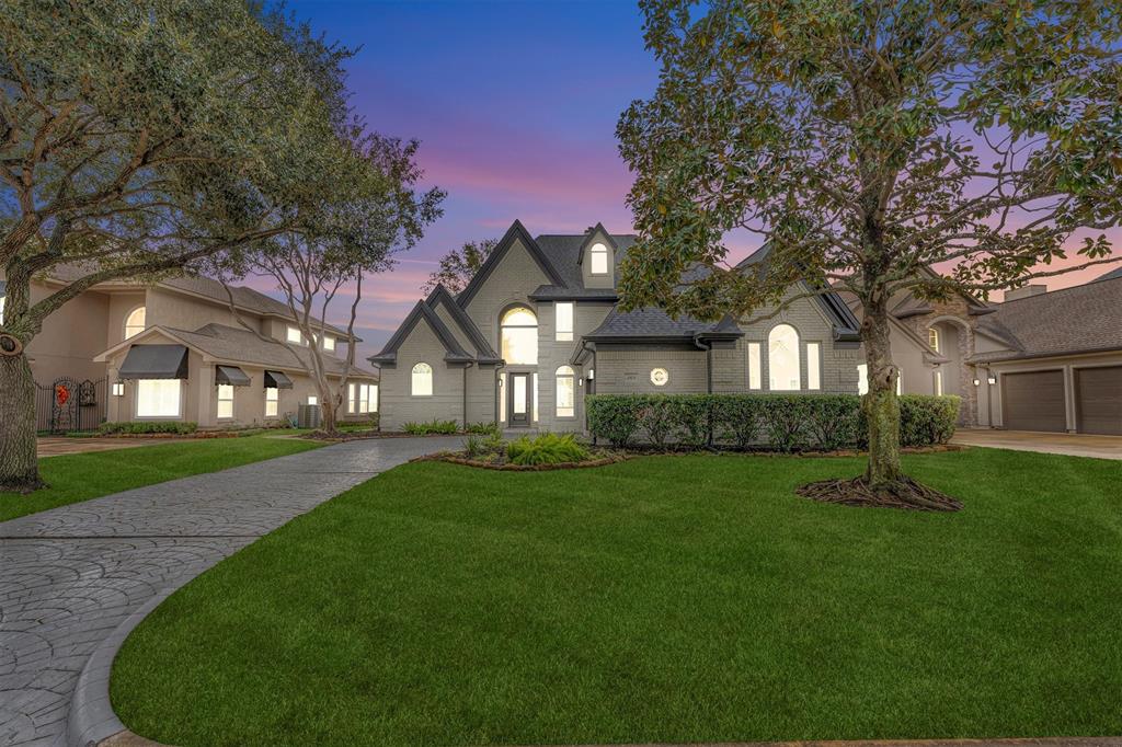 a view of a big yard next to a house