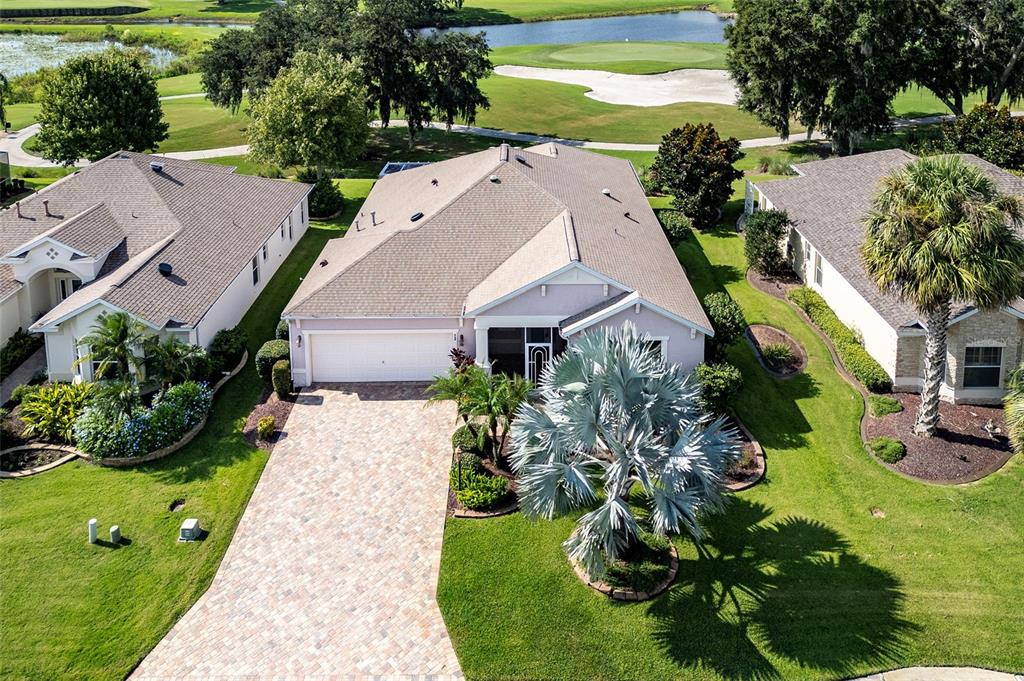 GOLF FRONT with ROOM FOR A POOL and BOND PAID on this Somerset Designer Home in The Village of Caroline.