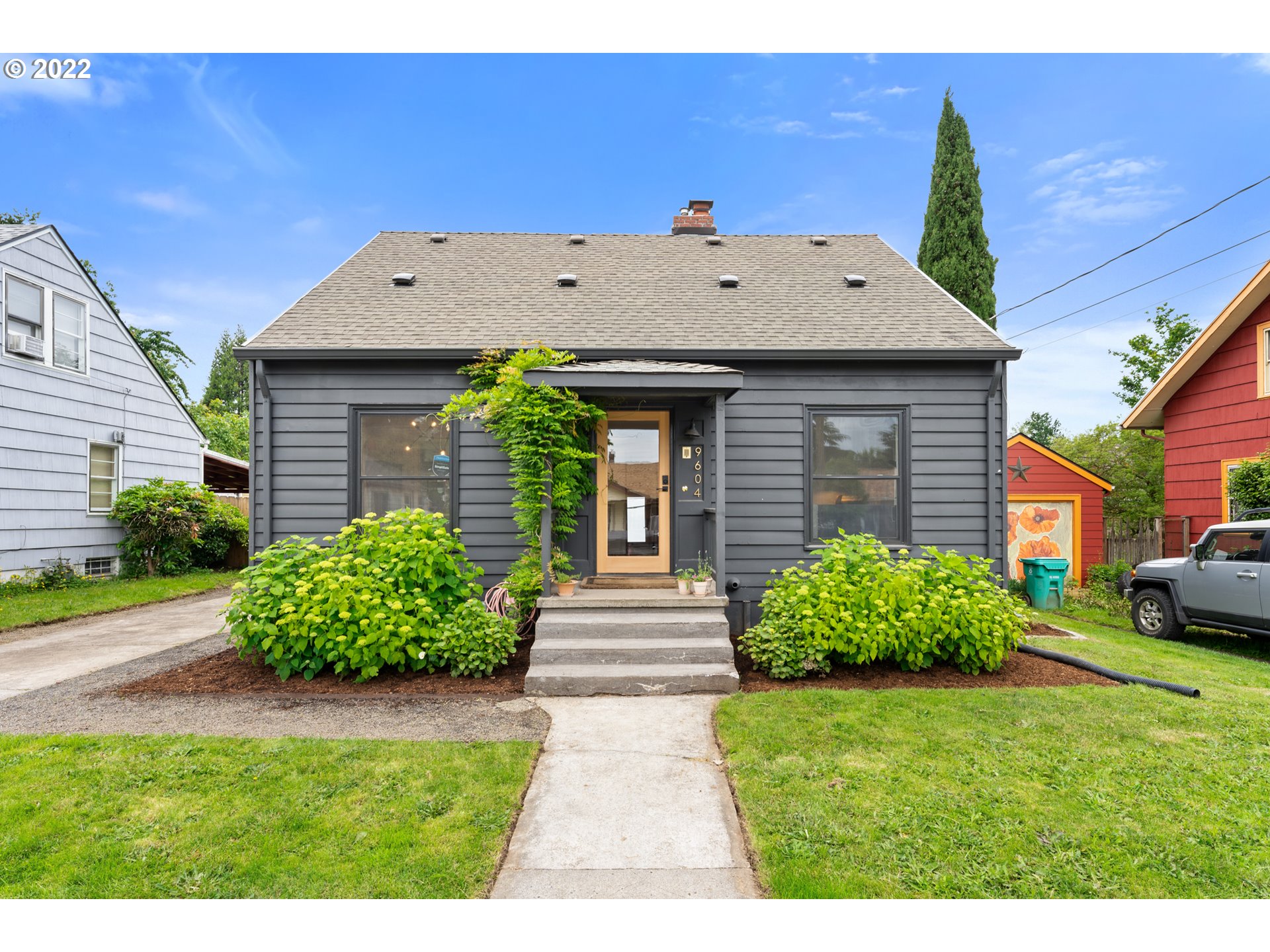 a front view of a house with garden