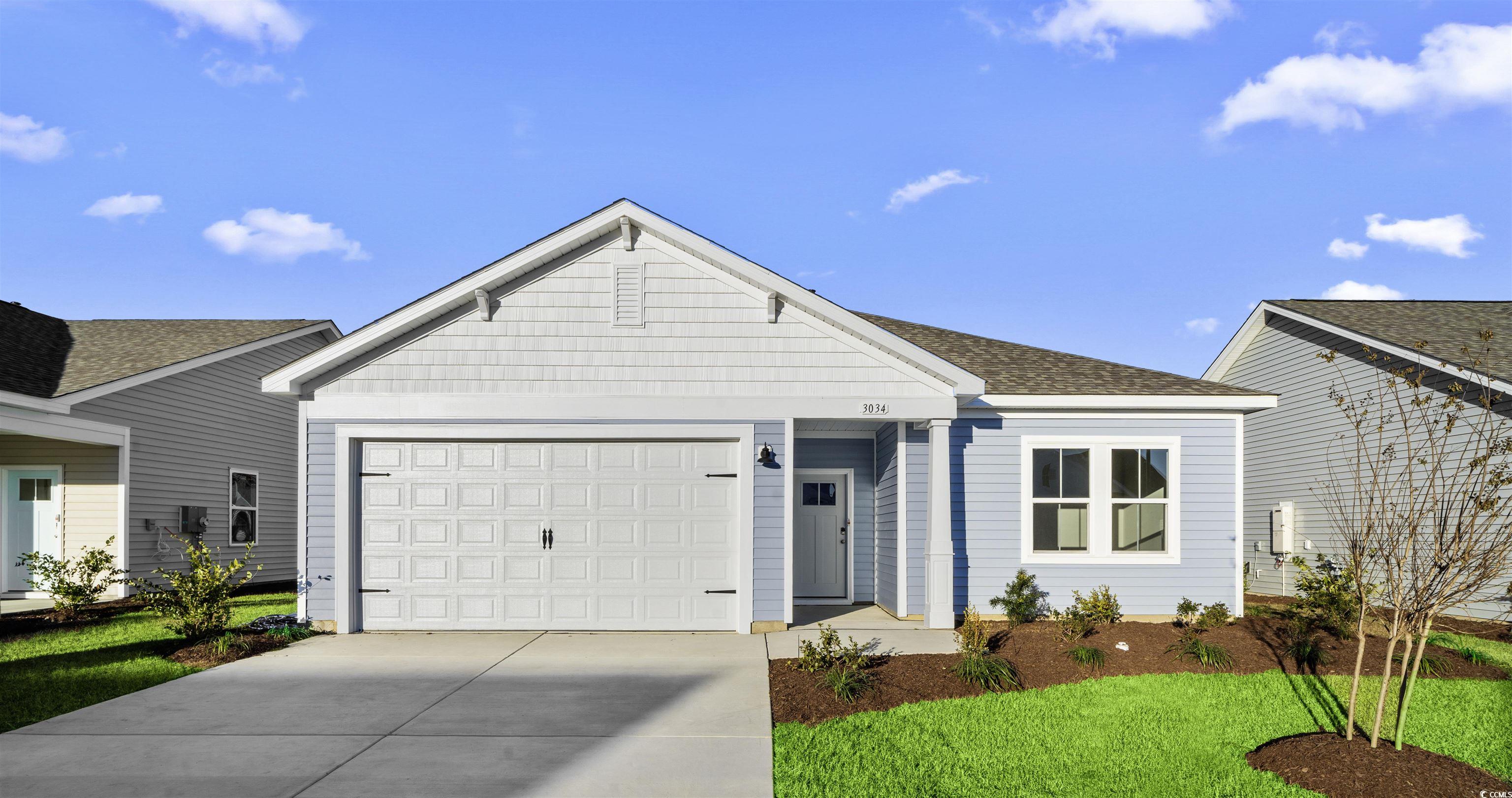 Ranch-style house featuring a garage