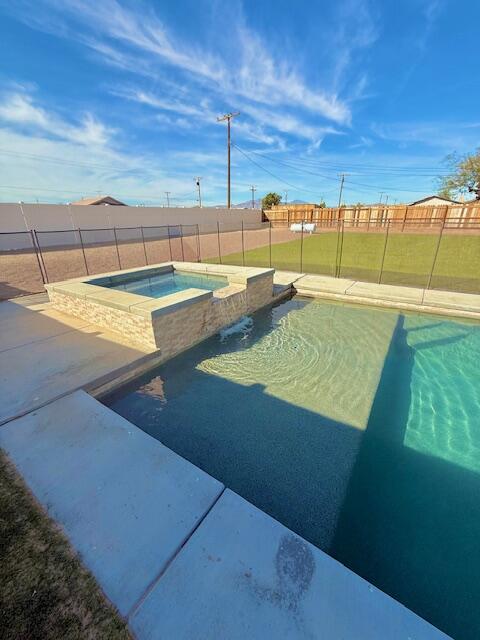 a view of a swimming pool with a lounge chair