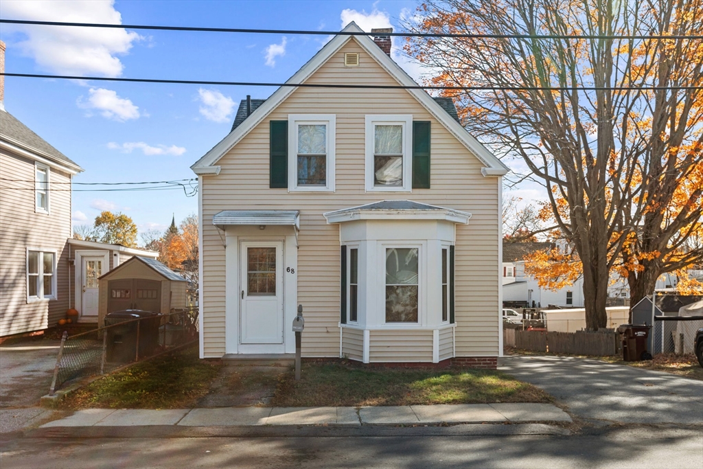 a front view of a house with a garage