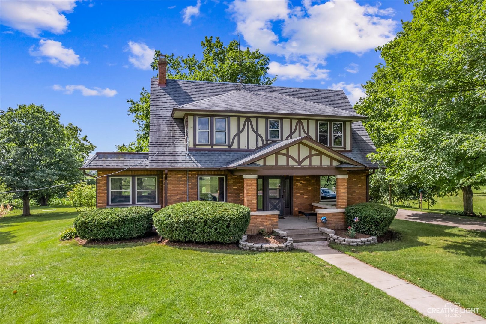 a front view of a house with a yard