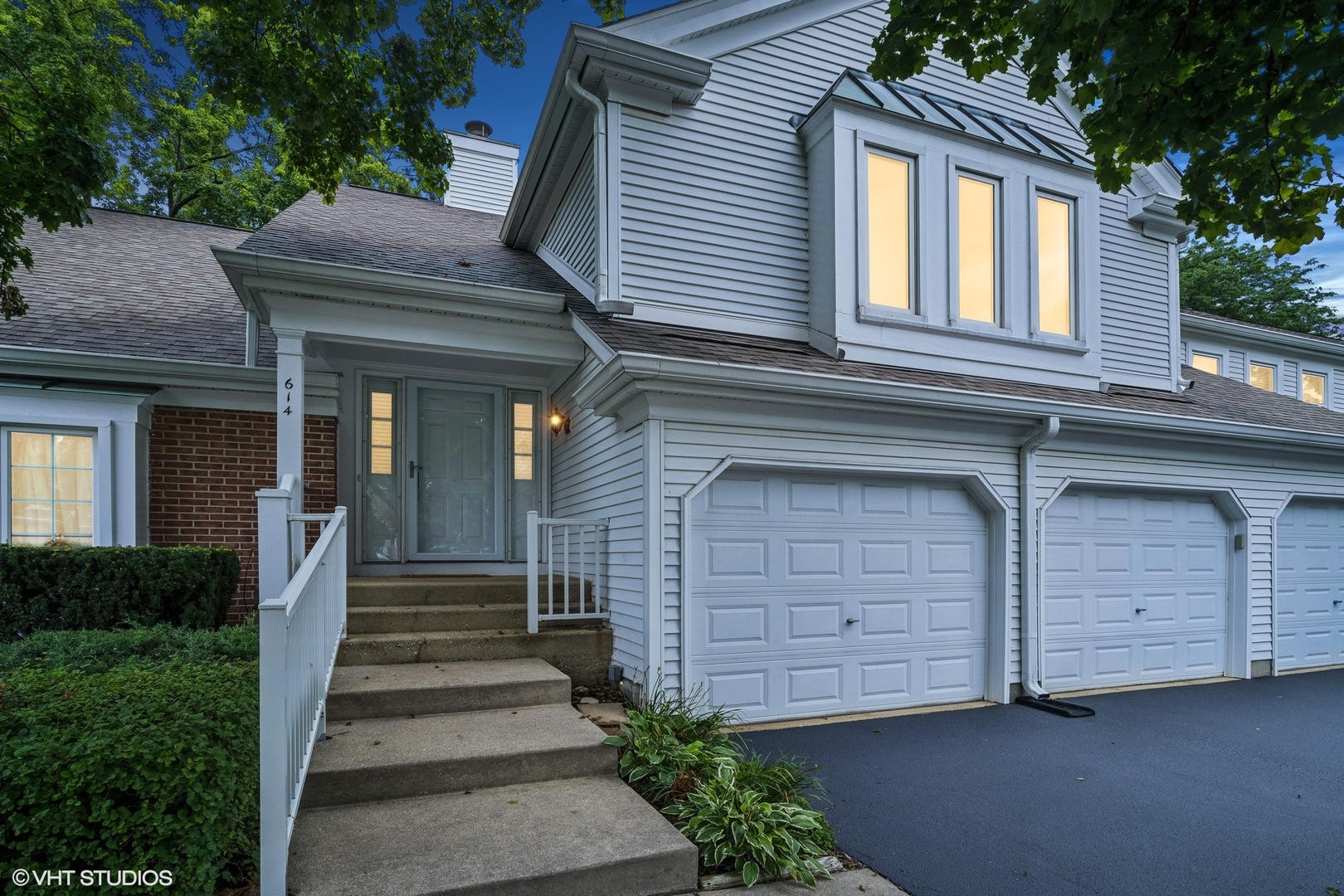 a front view of a house with garage