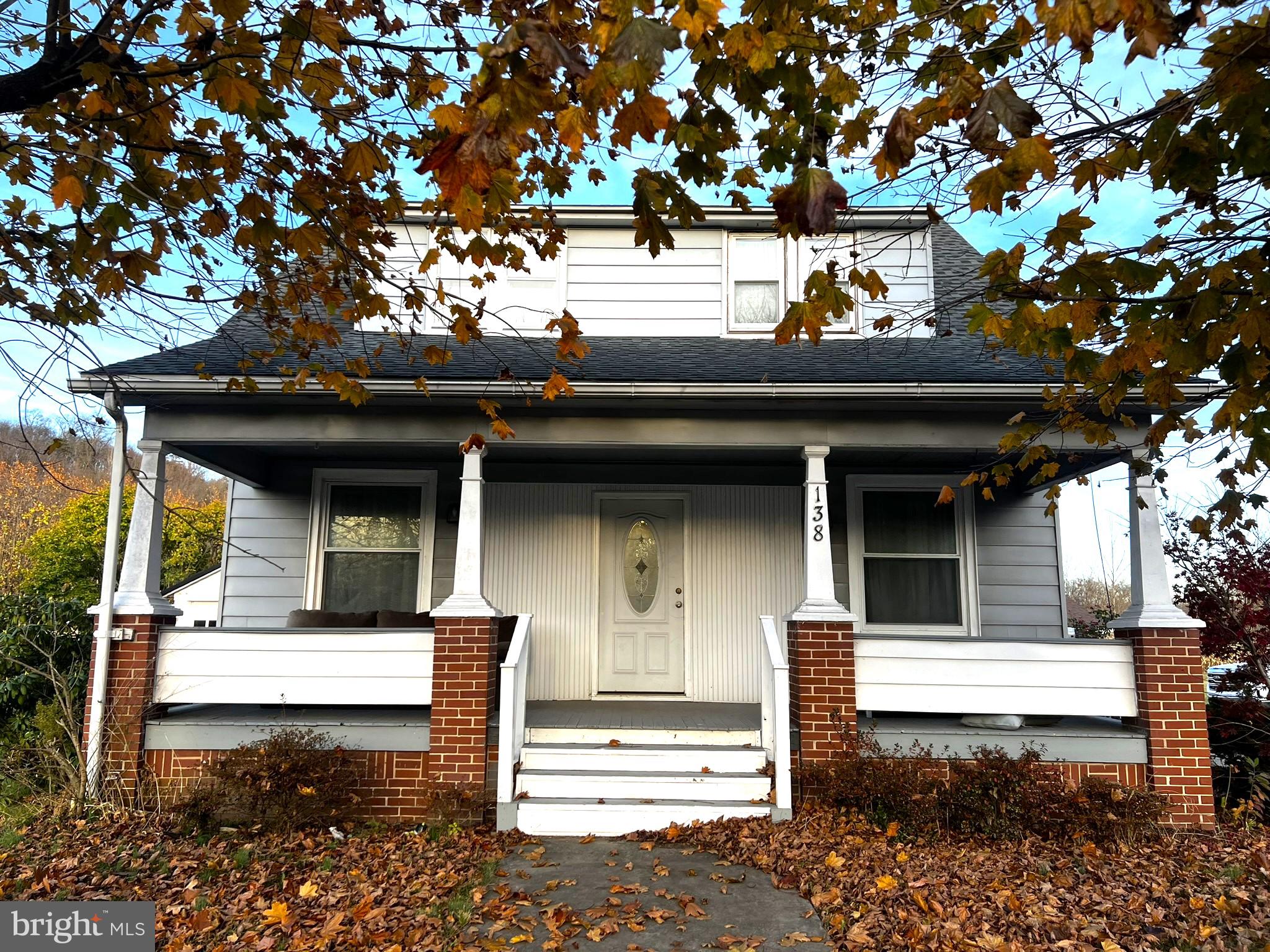 a front view of a house with stairs