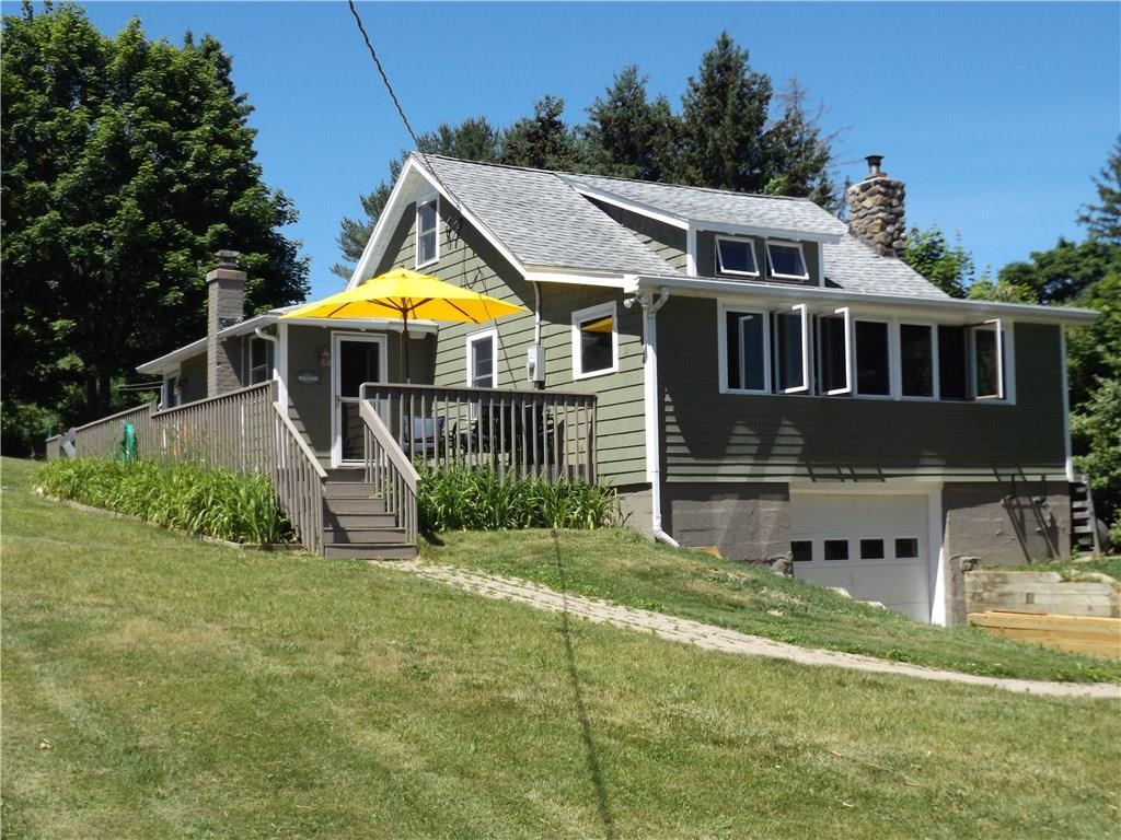 a view of house with a yard