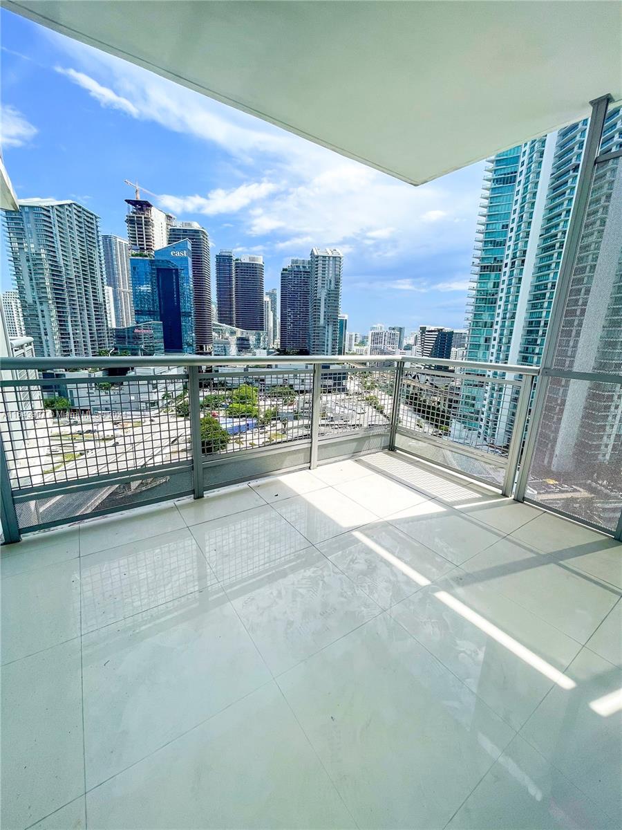 a view of roof with city view