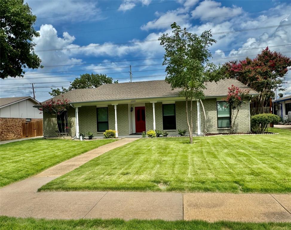 front view of a house with a yard