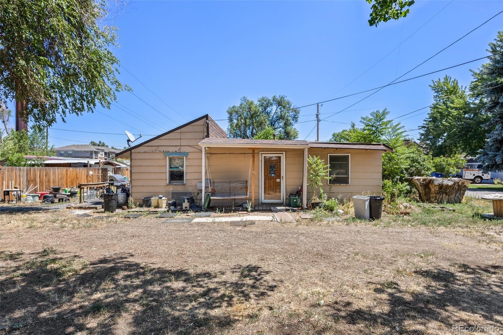 a front view of house with yard and seating space