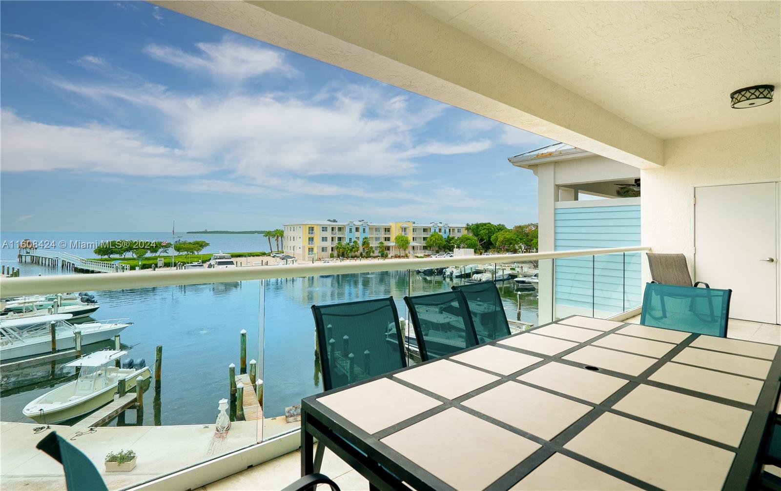 a view of a balcony dining table and chairs