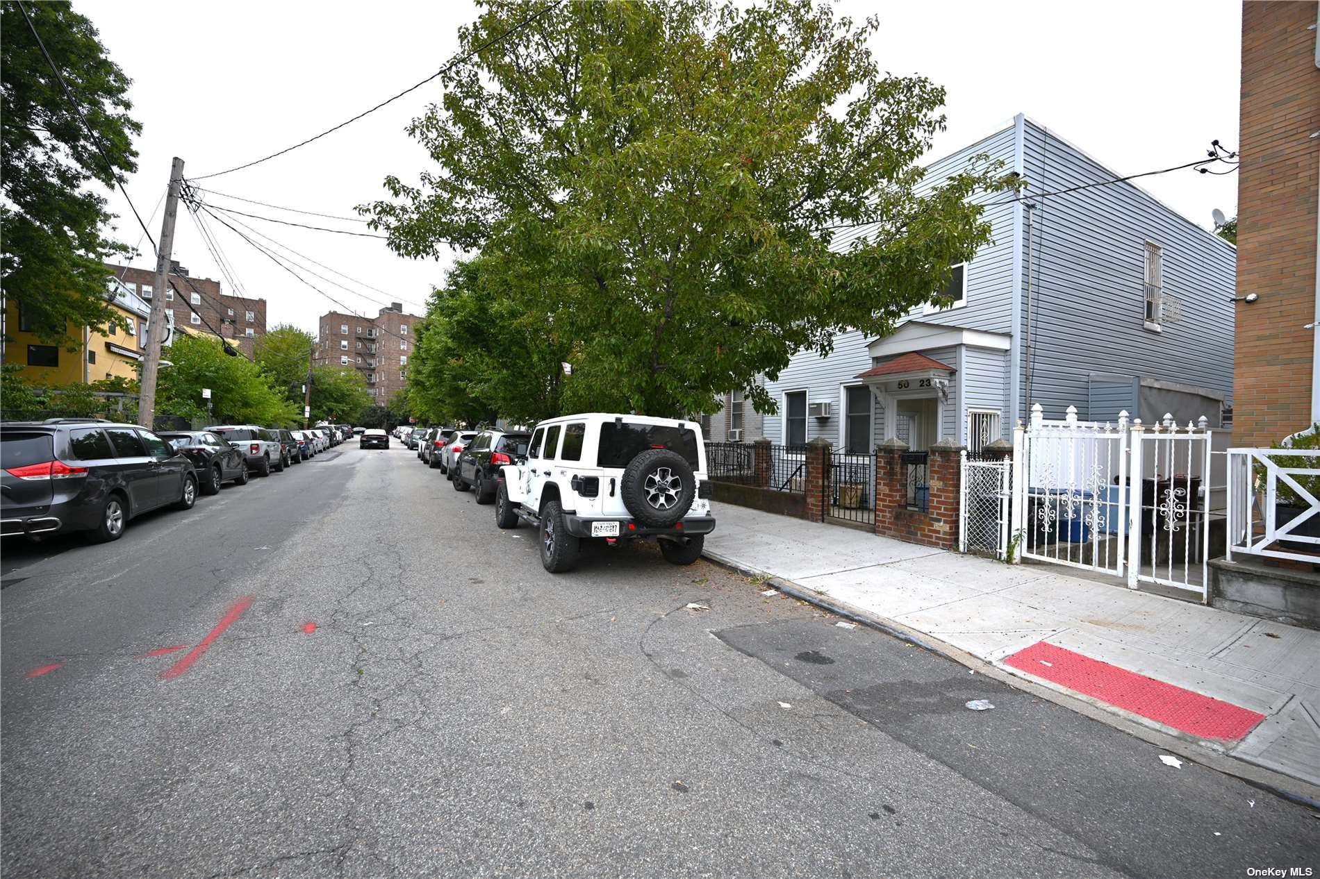 a view of a car parked in front of a house