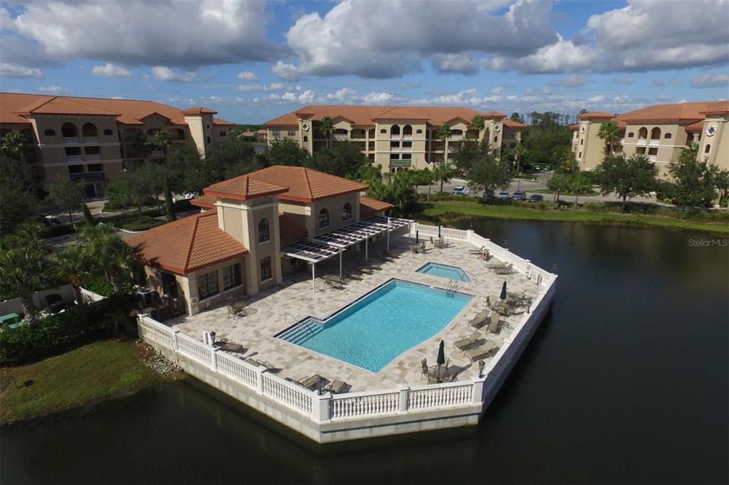 an aerial view of a house with a lake view