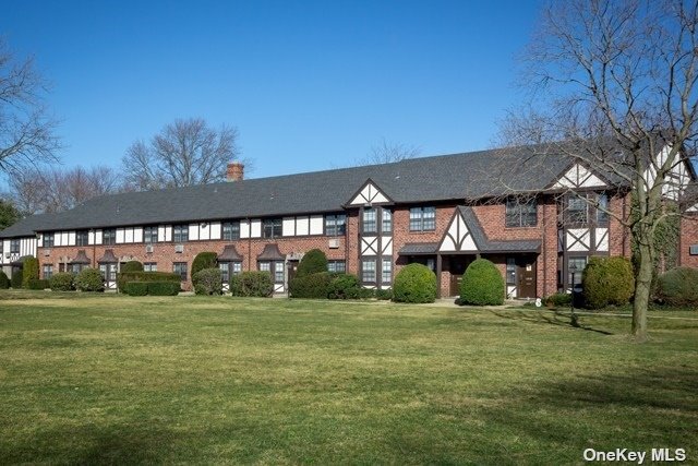 a view of a house next to a big yard