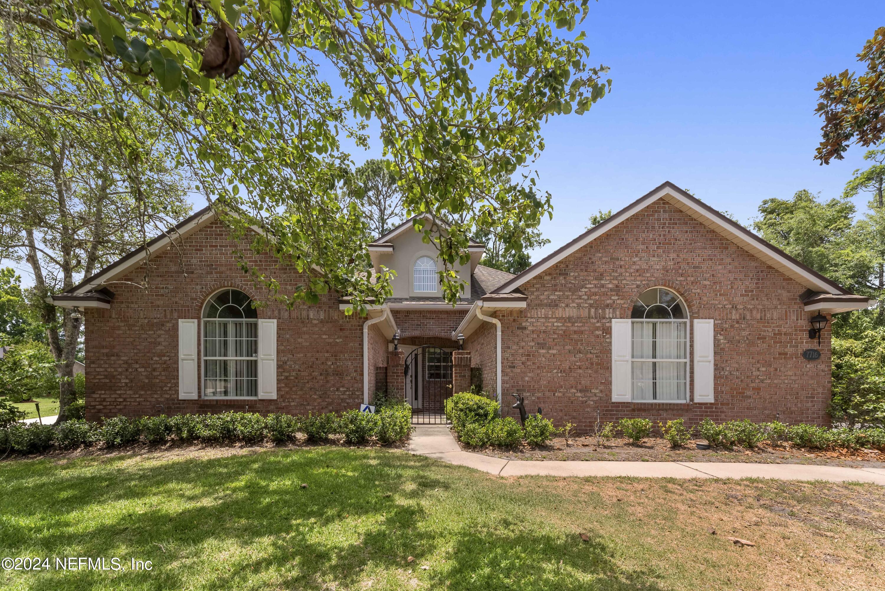 front view of a house with a yard