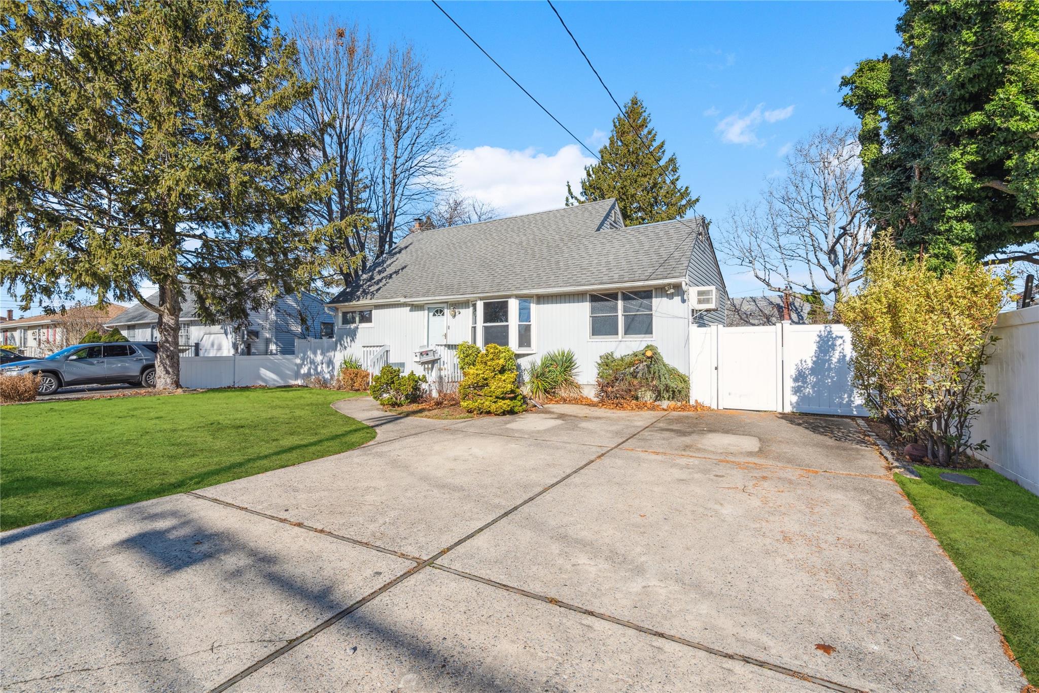 View of front of property with a front lawn