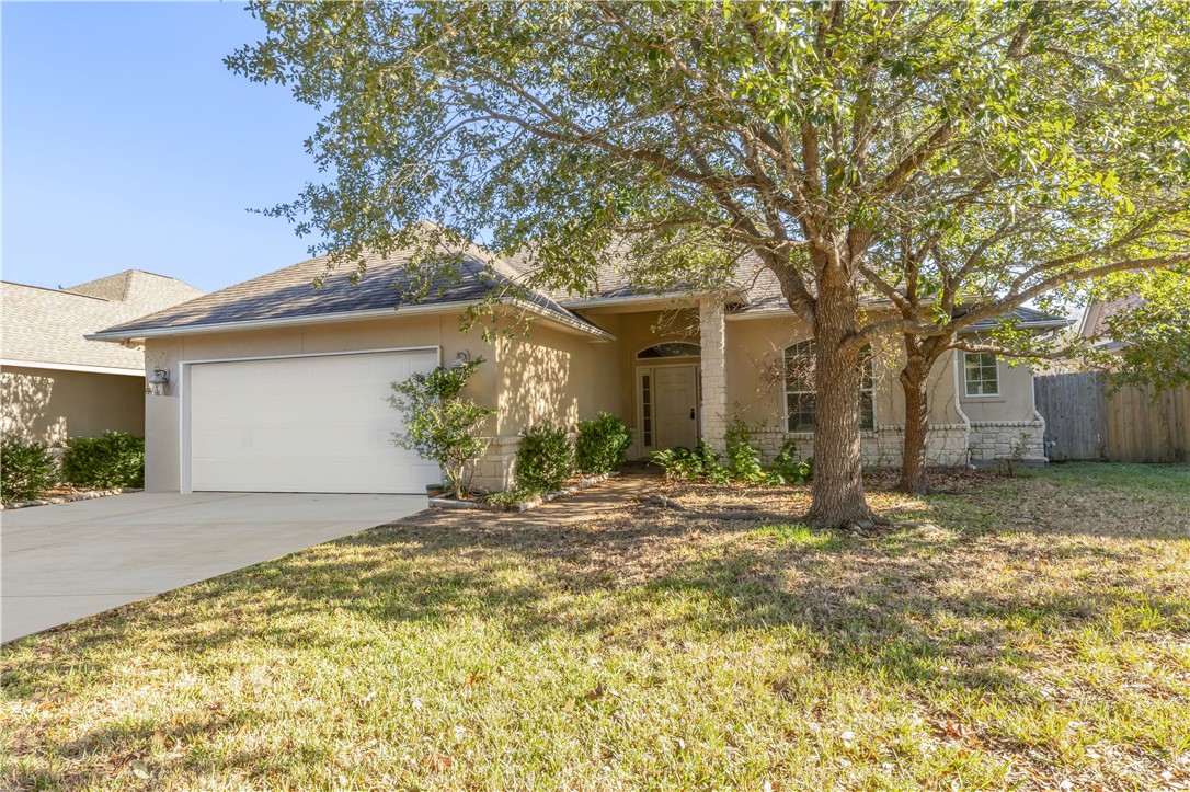 View of front of home featuring a garage and a fro