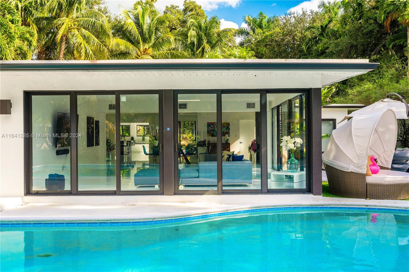 a view of swimming pool with a patio