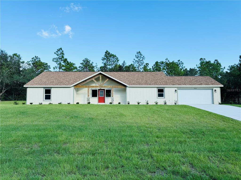 a view of a yard in front of a house with a yard