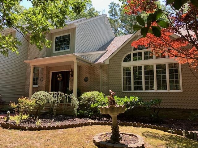 a front view of a house with a yard