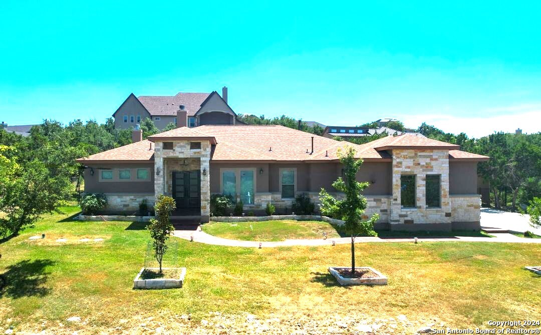 a front view of a house with swimming pool