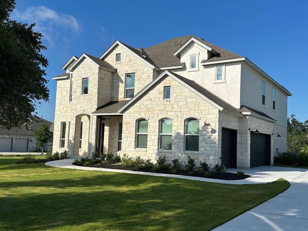 a front view of a house with a yard