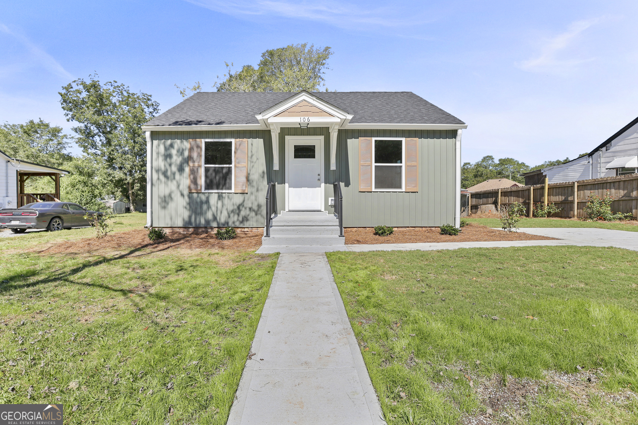 a front view of a house with a yard