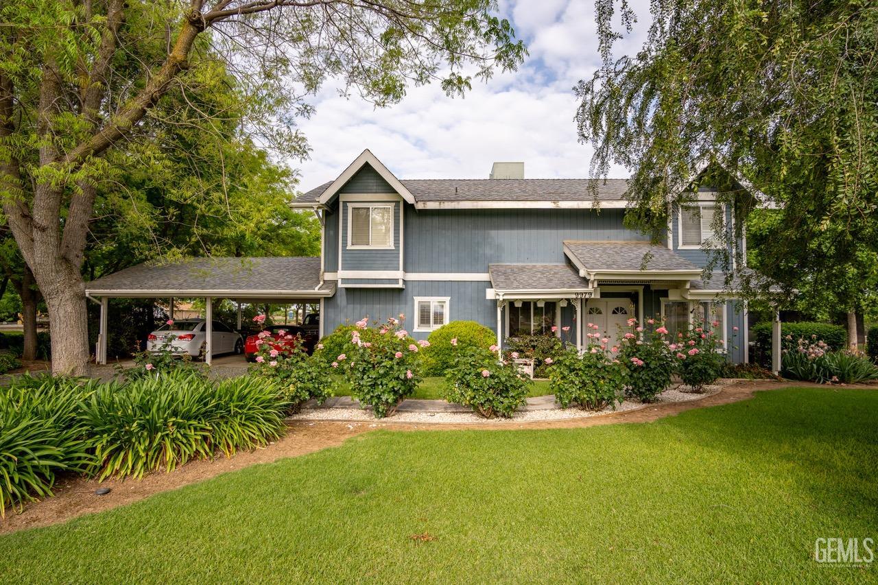 a front view of house with yard and green space