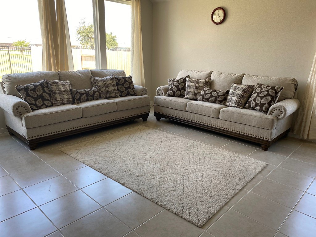 a living room with furniture and a couch