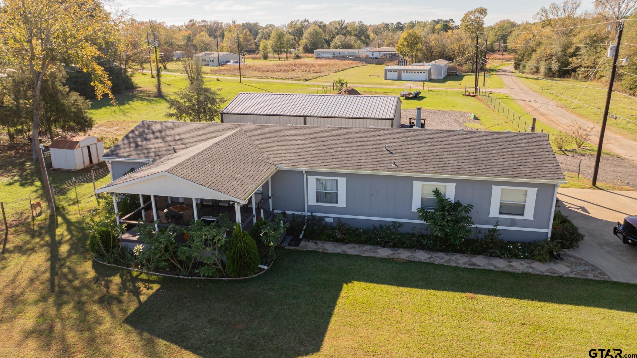 an aerial view of a house with swimming pool