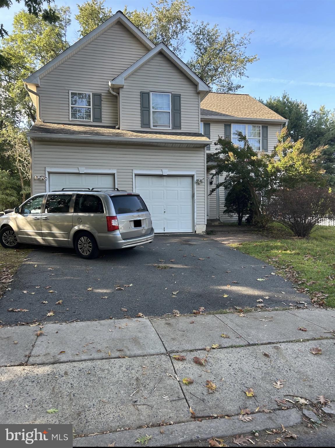 a view of a car parked in front of a house