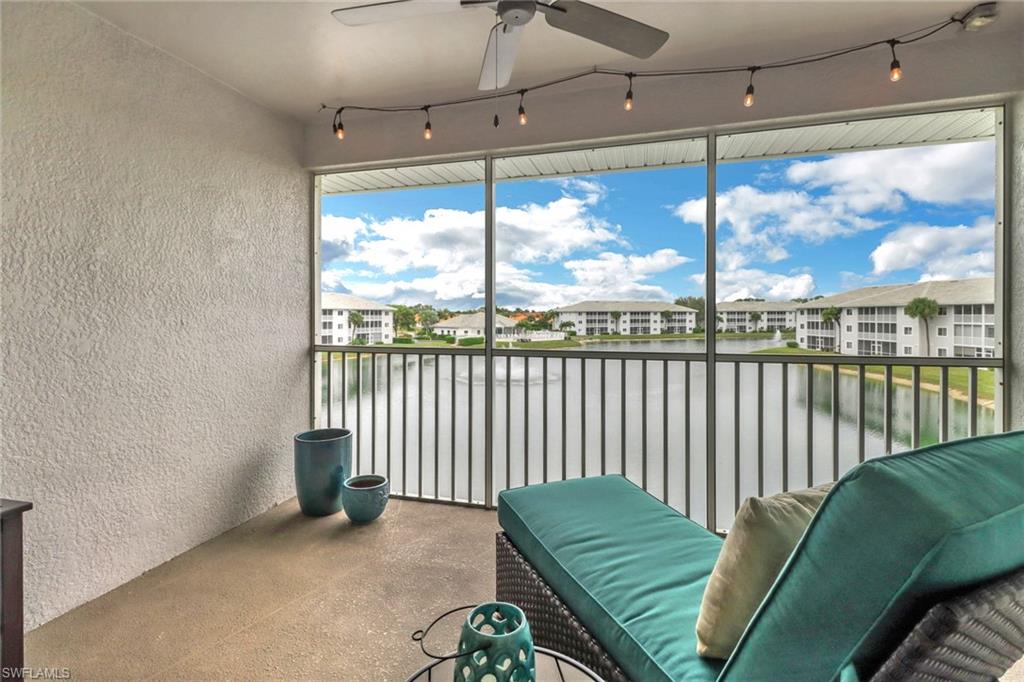 a view of a living room and a floor to ceiling window