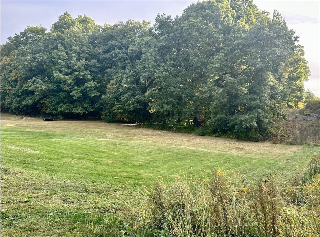 a view of a field with an outdoor space