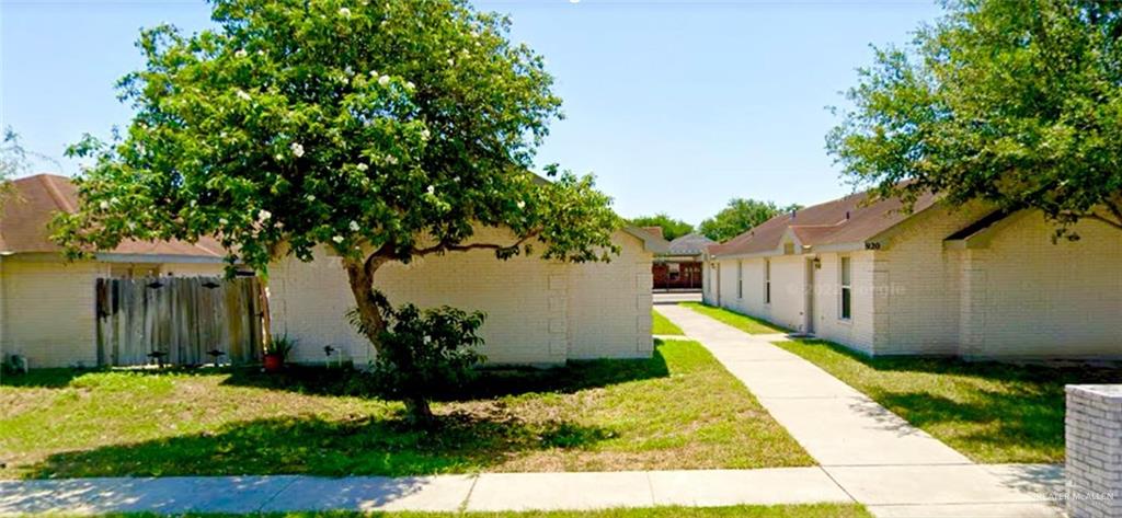 a view of a backyard with pathway