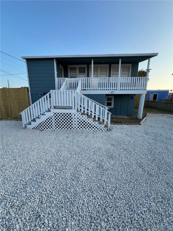 a view of a porch with a bench