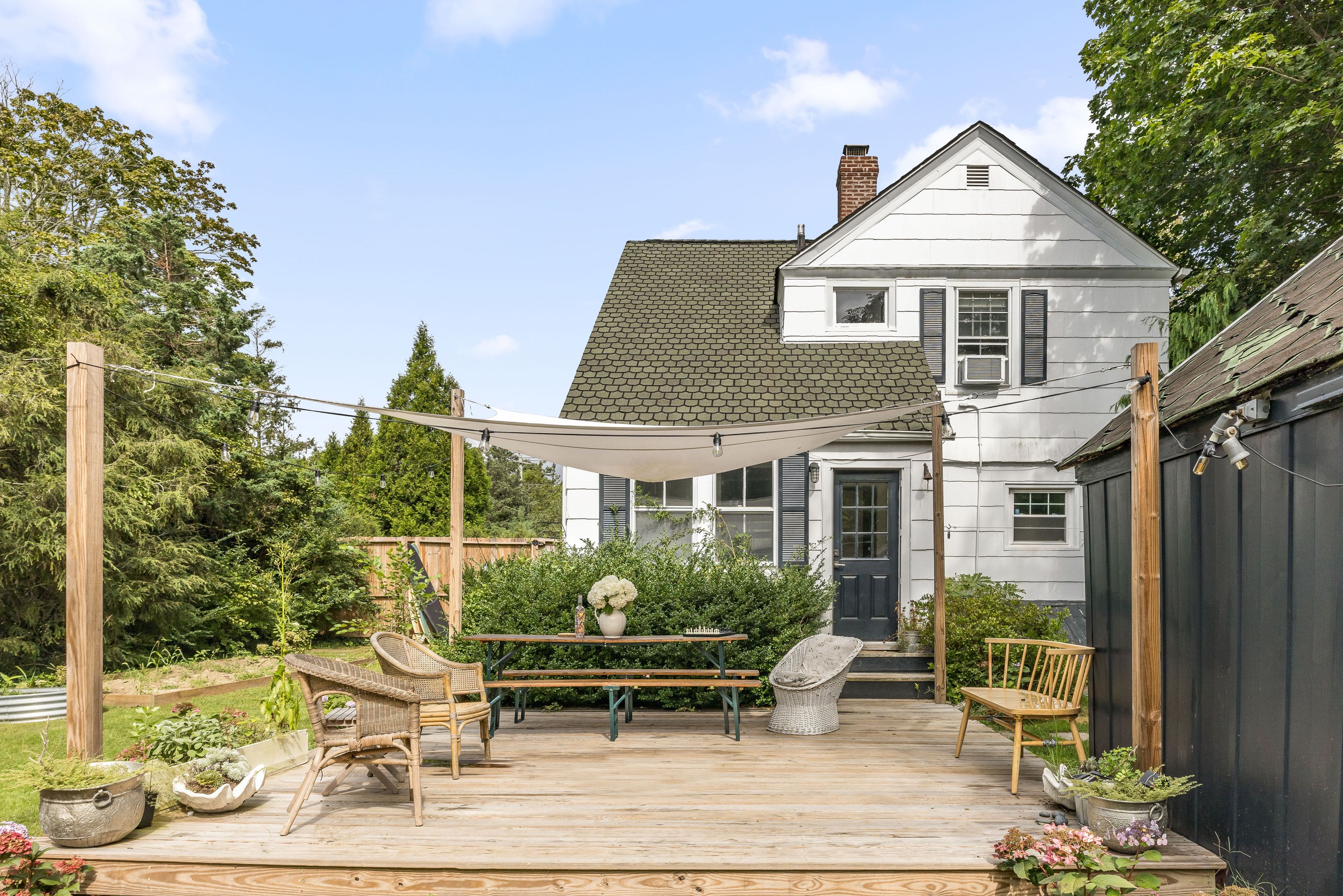 a front view of a house with garden